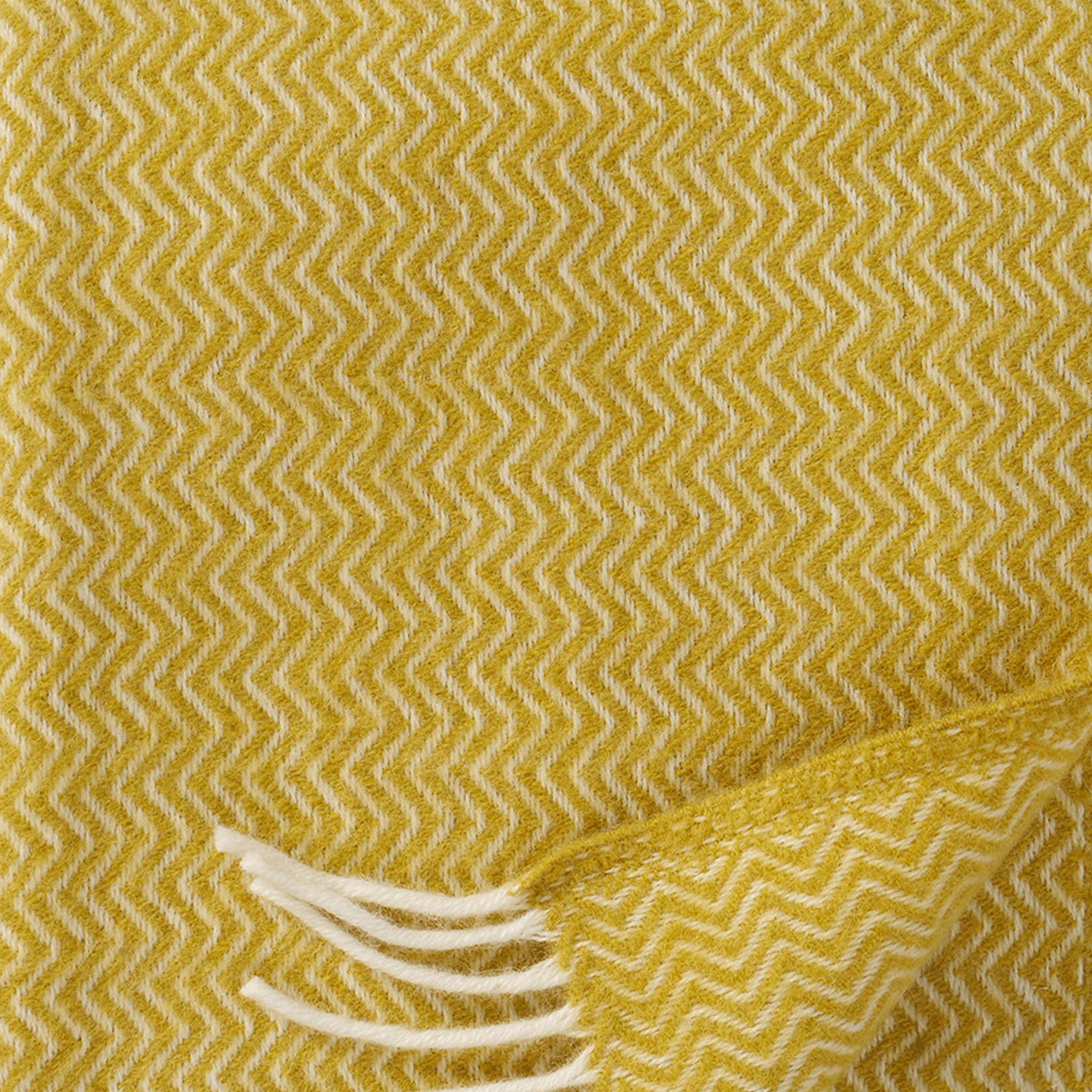 Close up of Klippan Homestore's Sorbet throw in banana colour