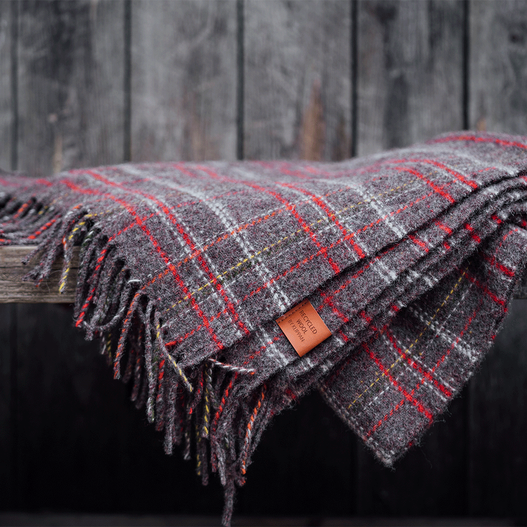 Klippan's Square throw on a bench outside