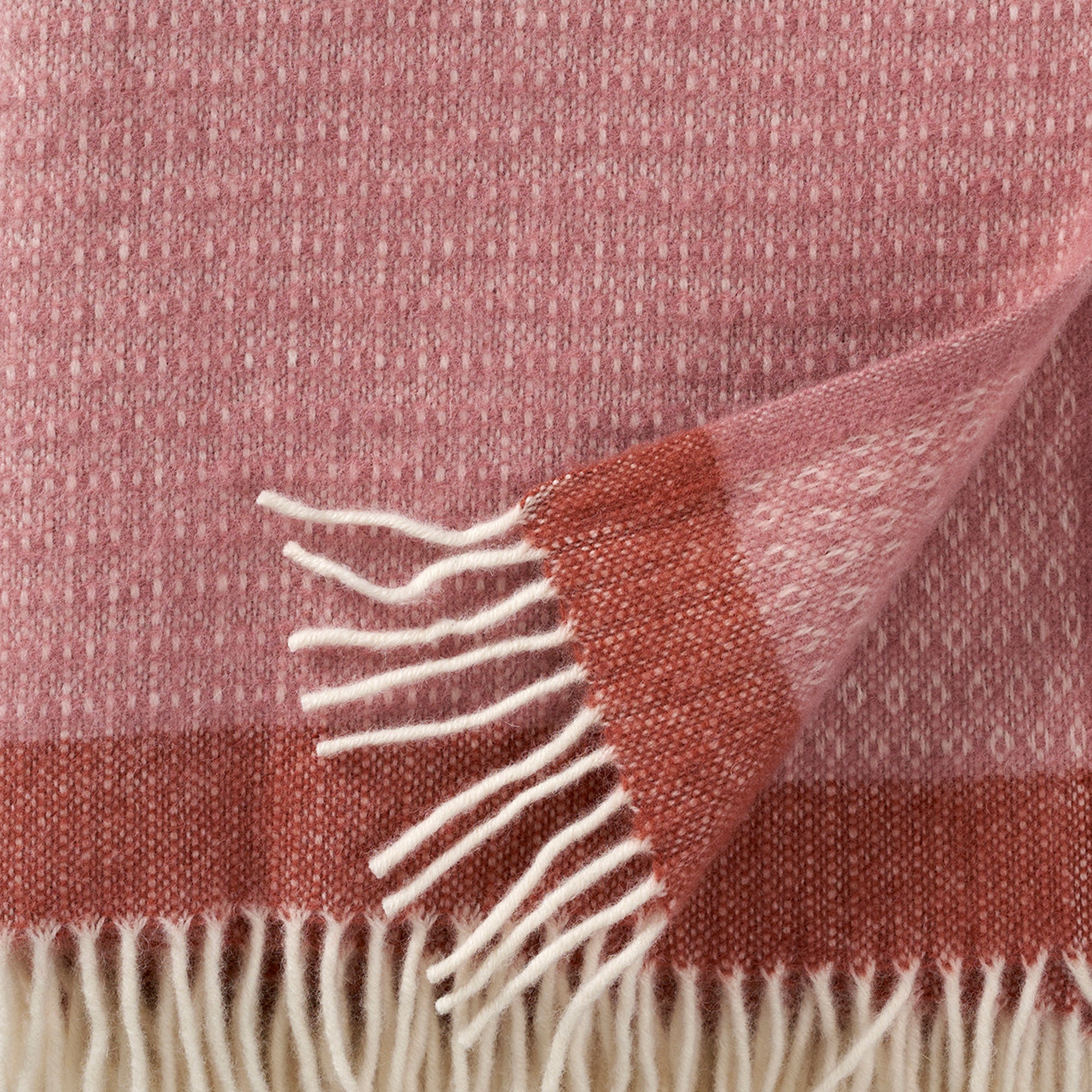 Close up of Klippan's Harald Dusty Rose and copper thow showing texture and weave