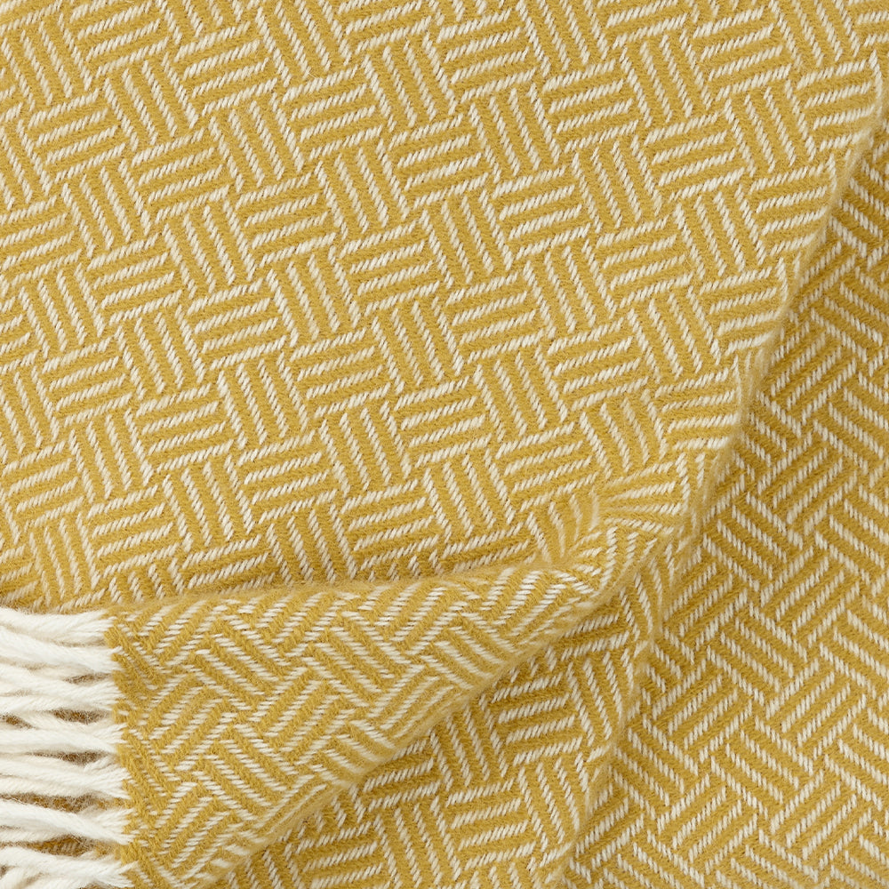 Close up of Samba yellow throw showing texture and weave Klippan Homestore