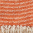 Close up of Klippan Ralph orange throw showing weave and texture