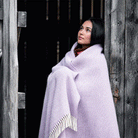 Girl in the doorway with Klippan Preppy lambswool throw