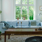 Blue sofa with Sorbet throws in silky blue and pistachio colourways from Klippan Homestore