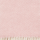 Close up of the weave of Preppy rose pink lambswool throw from Klippan