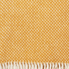 Close up of Klippan Preppy Mustrad lambswool throw showing the weave
