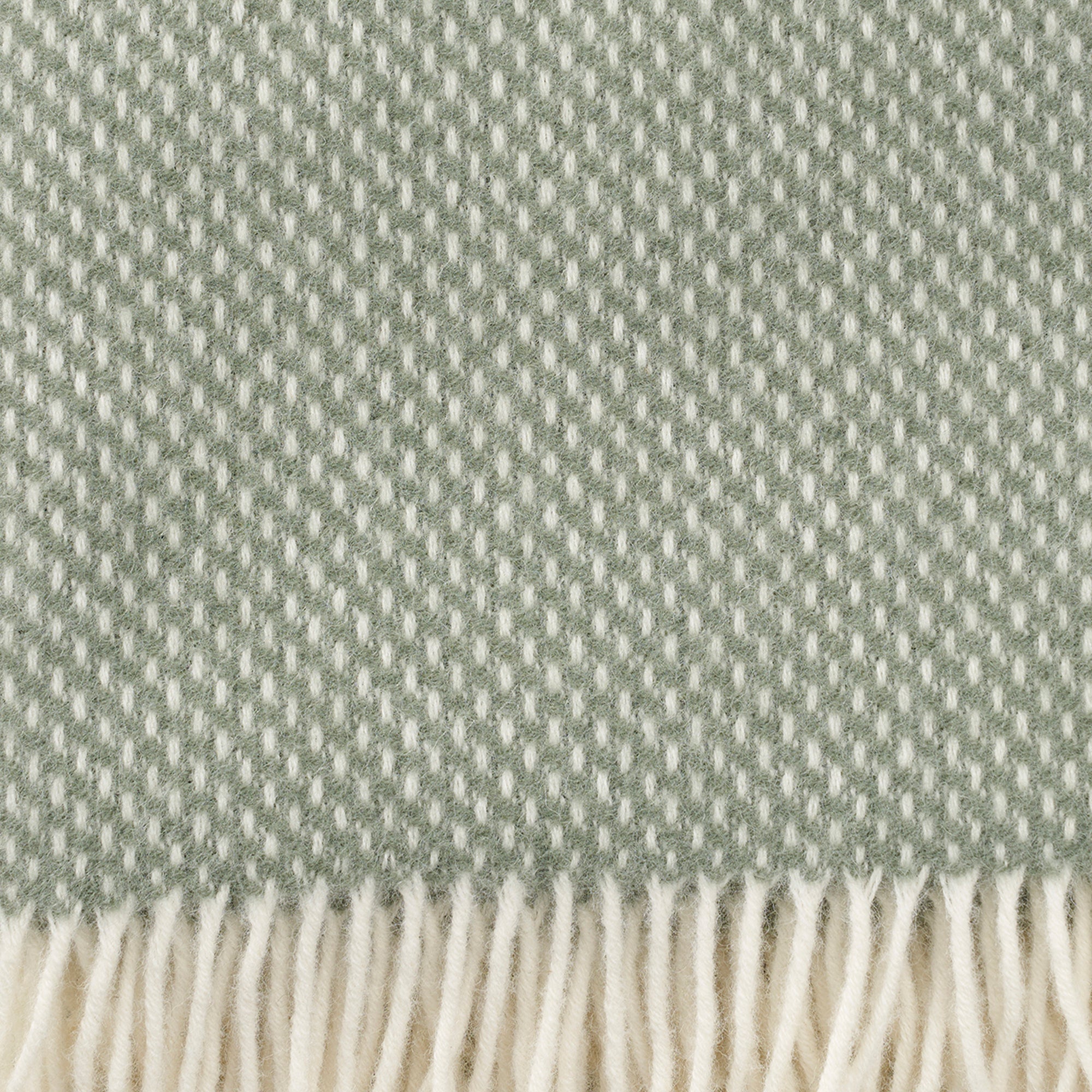 Close p of Klippan Preppy dusty green lambswool throw showing the weave