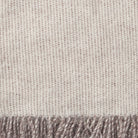 Close up showing the weave and texture of Simmer natural lambswool blanket