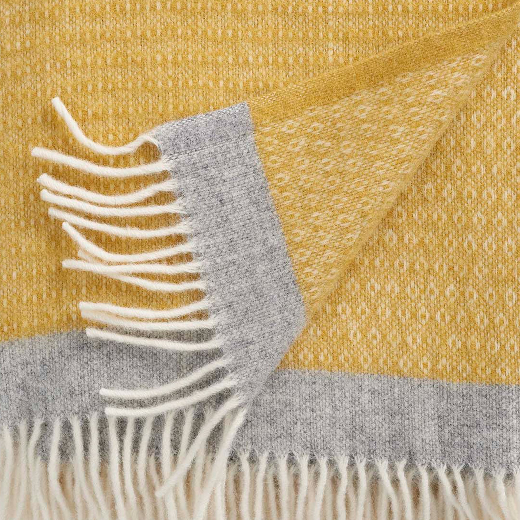 Klippan's Harald Yellow and grey throw showingclose up of texture and weave