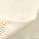 Close up showing texture and weave of Klippan Ralph throw in Ivory colour