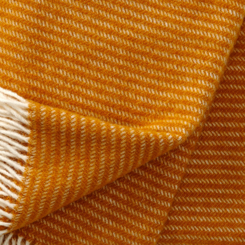 Close up of Ralph Mustard Lambswool showing texture and weave, Klippan